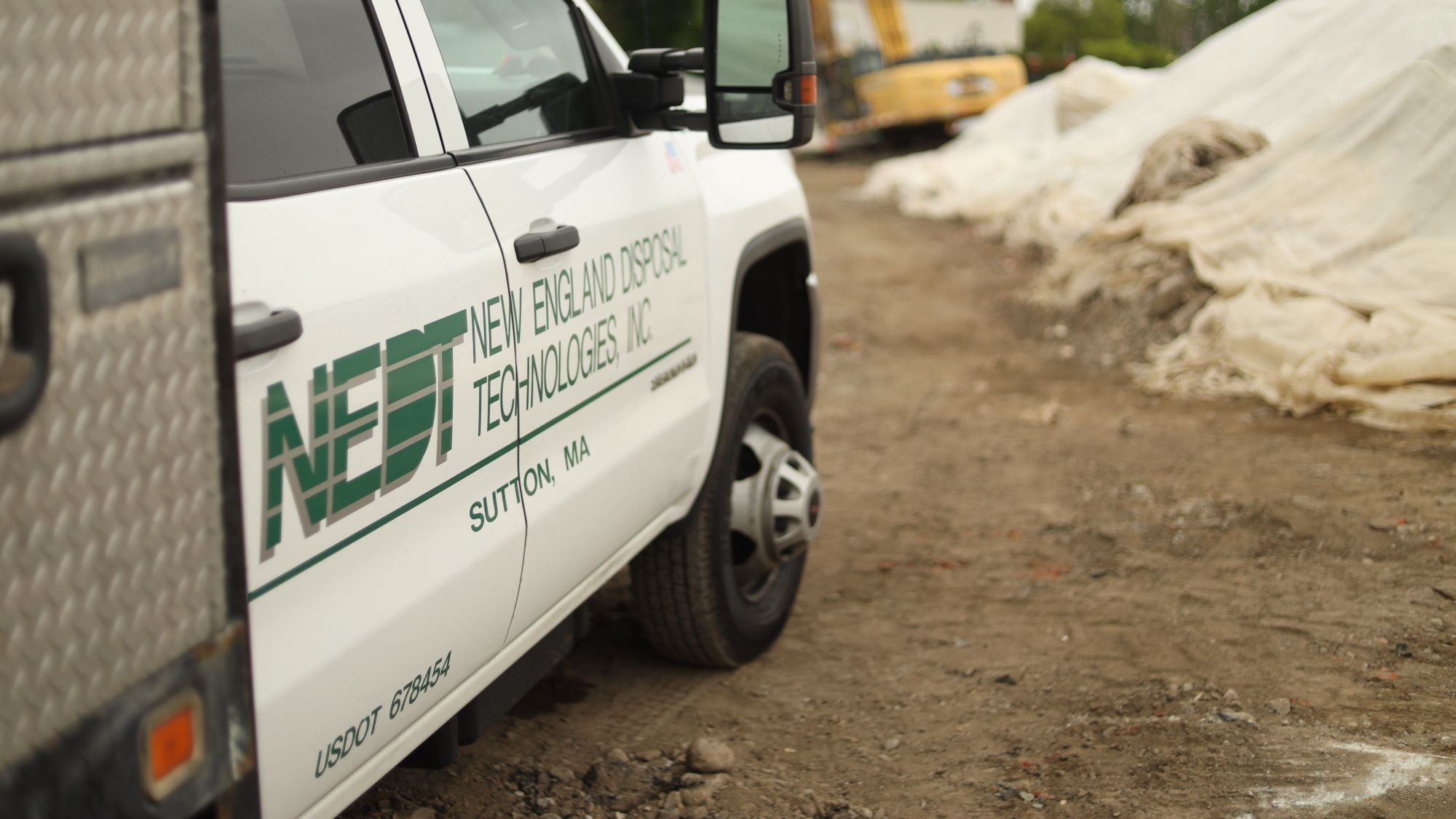 NEDT utility truck pulled up to a contaminated property.