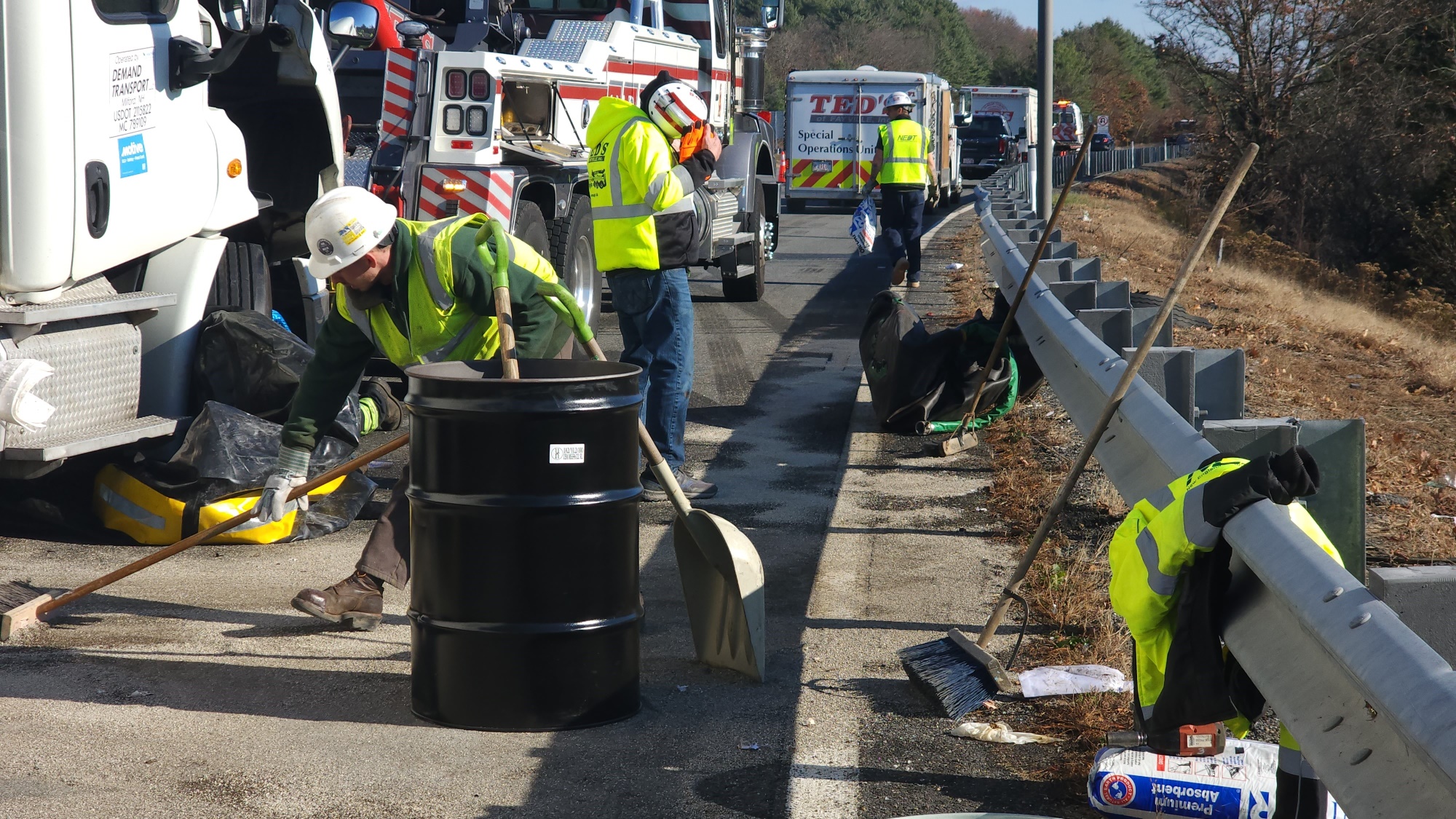 NEDT emergency response staff at a spill response, cleaning and decontaminating the site.